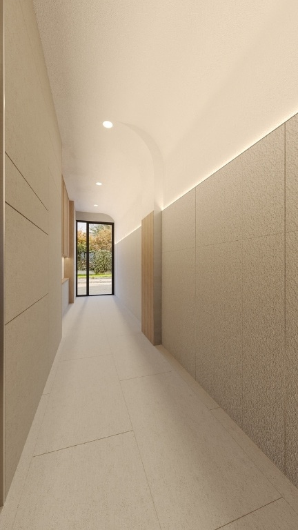 hallway with tile patterned flooring