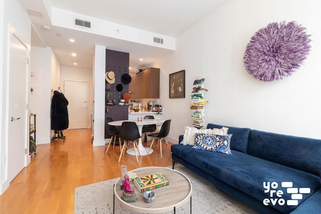 living room with light hardwood / wood-style floors