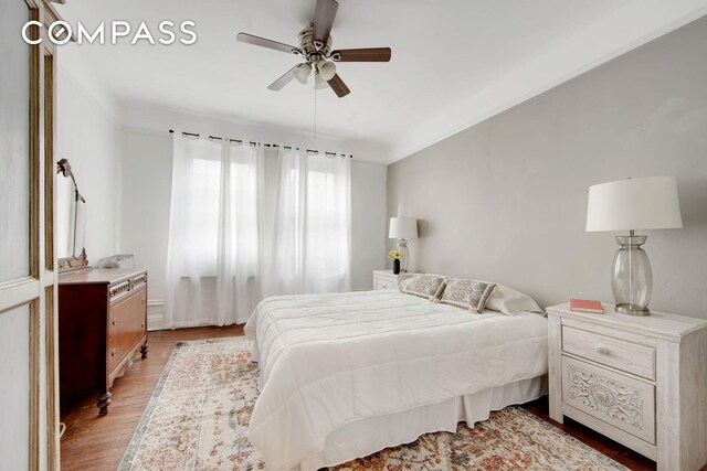 bedroom featuring light hardwood / wood-style flooring and ceiling fan