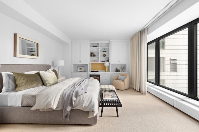 bedroom featuring access to outside and light colored carpet