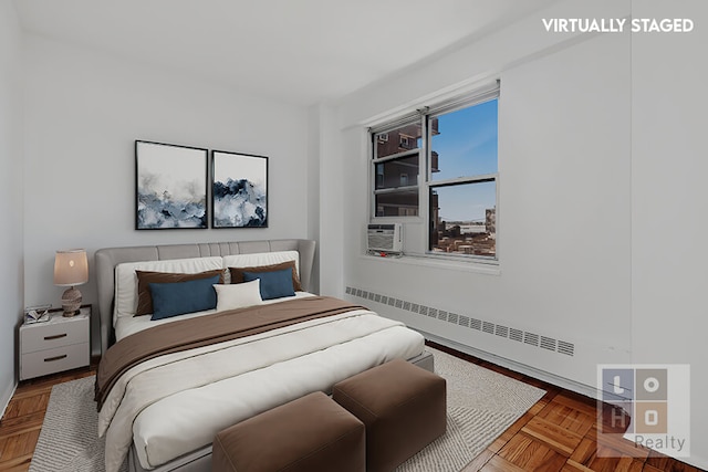 bedroom featuring cooling unit and a baseboard radiator