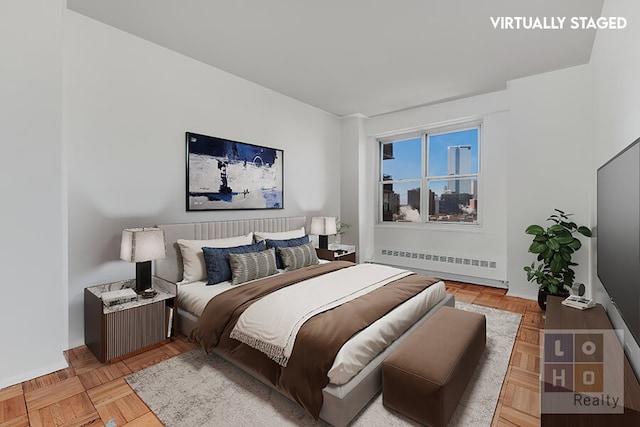 bedroom featuring radiator and baseboards