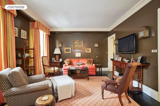 sitting room featuring crown molding, a fireplace, and hardwood / wood-style flooring