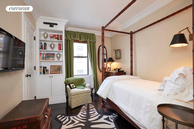 bedroom featuring ornamental molding and dark hardwood / wood-style floors