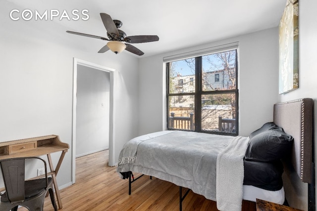 bedroom featuring ceiling fan and light wood-type flooring