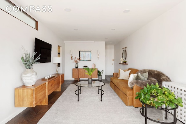 living room with dark parquet flooring