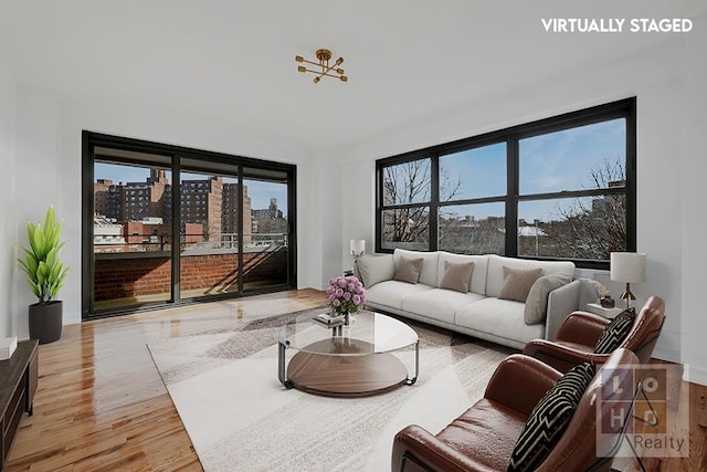 living area featuring a view of city and light wood-type flooring