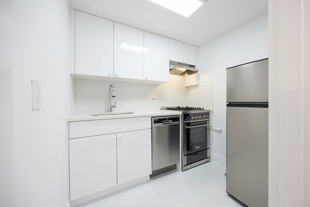 kitchen with white cabinetry, appliances with stainless steel finishes, and sink