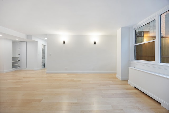 spare room featuring light hardwood / wood-style floors