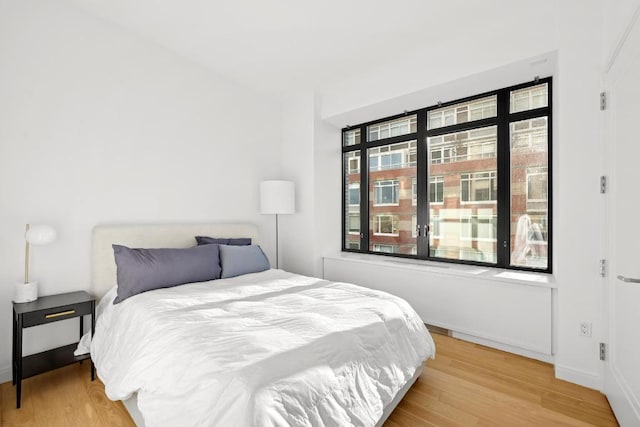 bedroom with light wood-type flooring