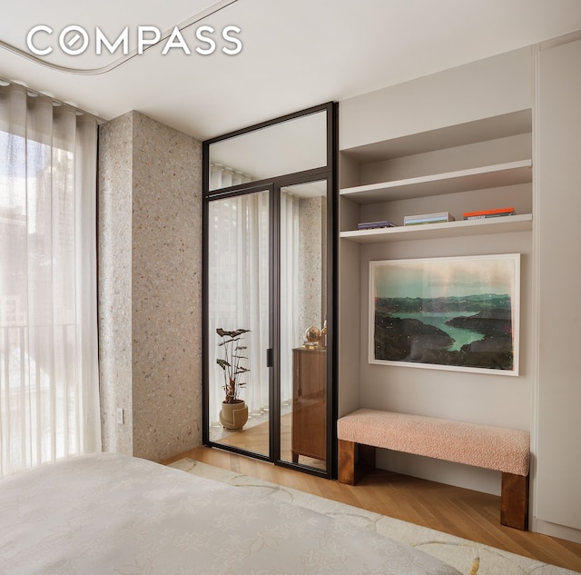 unfurnished bedroom featuring wood finished floors