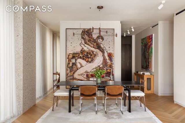 16 W 40th St Unit 16B, New York City, NY 10018 - dining room featuring parquet floors