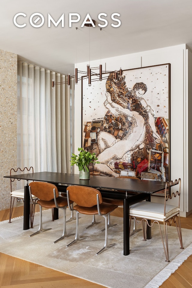 dining space featuring wood finished floors