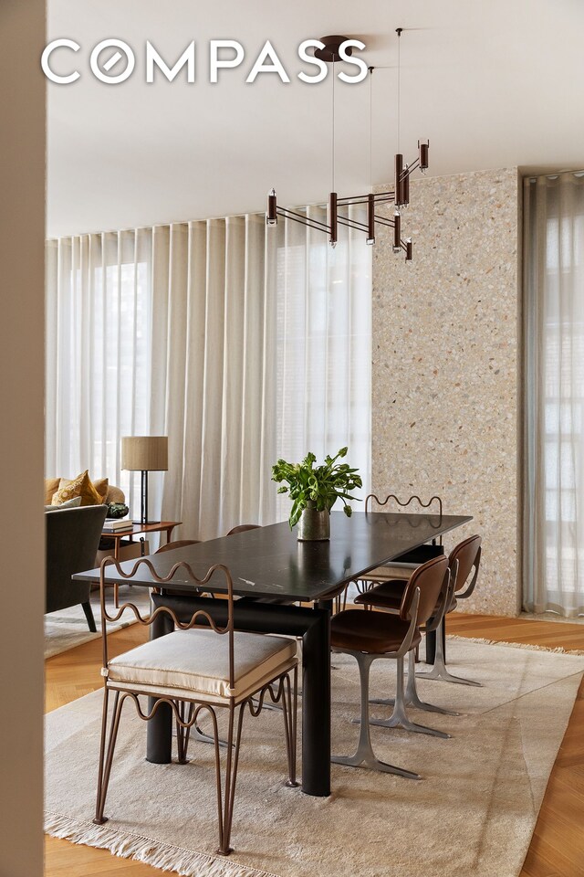 dining area with wood finished floors