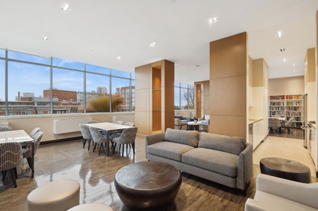 living area with light wood-style flooring and a view of city