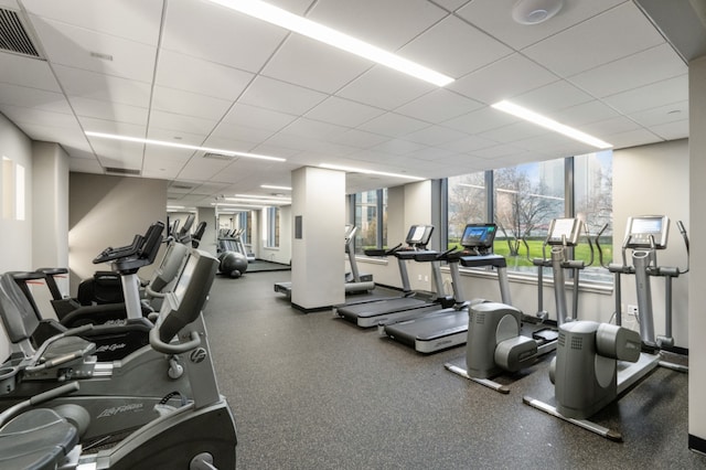 exercise room featuring visible vents and a drop ceiling