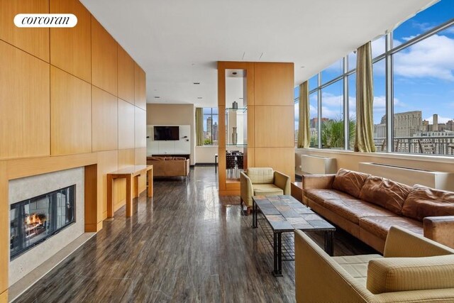 425 Main St Unit 16B, New York City, NY 10044 - living room featuring visible vents, a fireplace, and dark wood-type flooring
