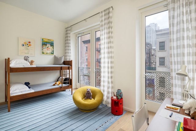 interior space featuring multiple windows and light hardwood / wood-style flooring