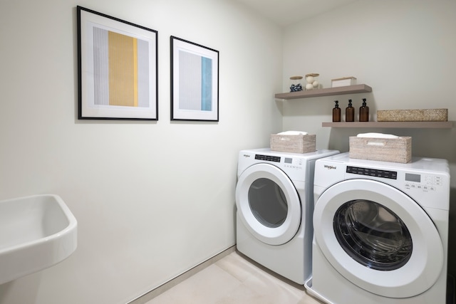 laundry area with sink and washing machine and dryer