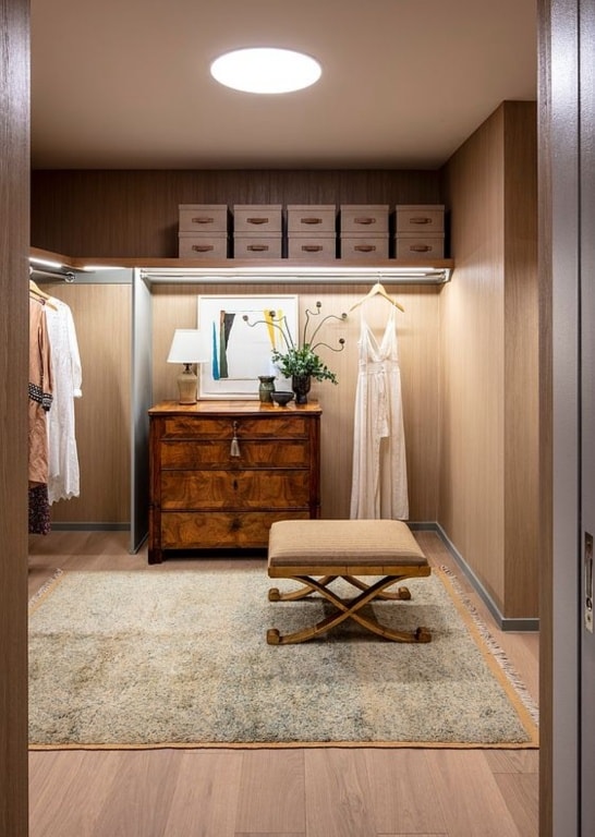 interior space featuring wood walls and light wood-type flooring