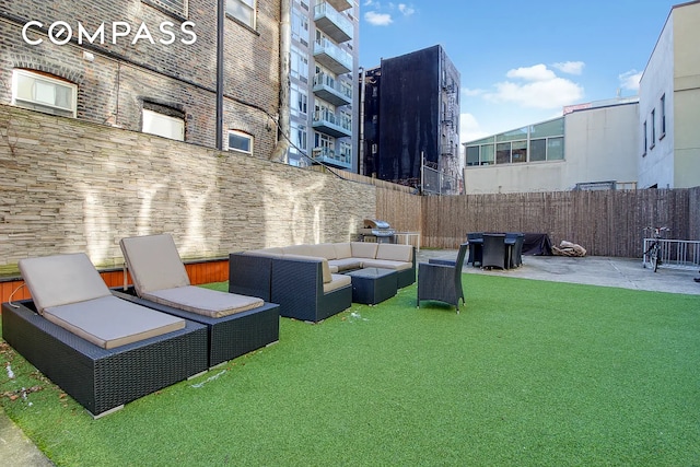 exterior space featuring an outdoor living space, fence, and a patio area