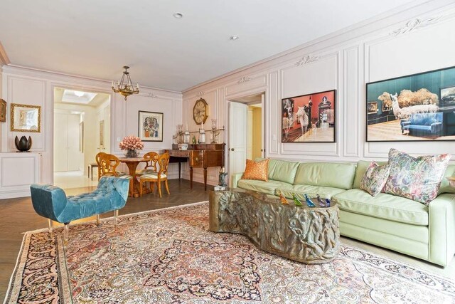 dining room with light parquet flooring, a chandelier, and crown molding