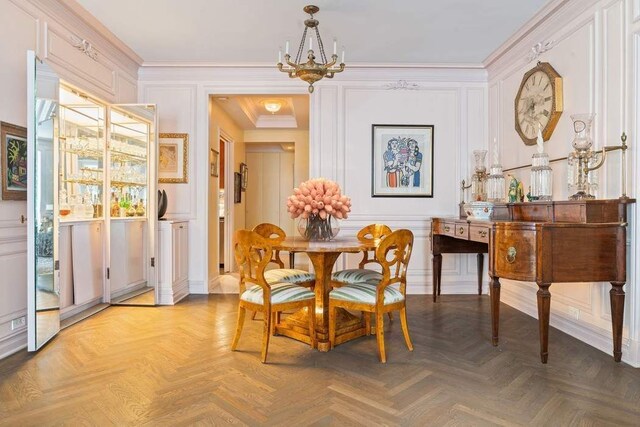 living room with crown molding and dark parquet flooring