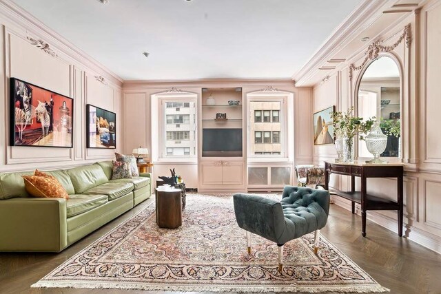 living room featuring crown molding and dark parquet floors