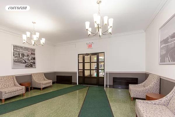 lobby with visible vents and heating unit