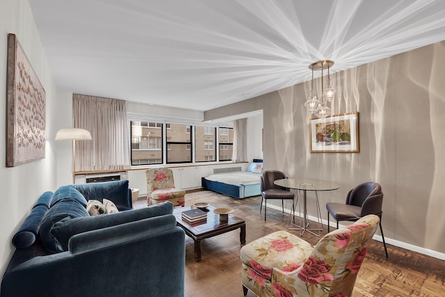 living room with radiator heating unit and baseboards