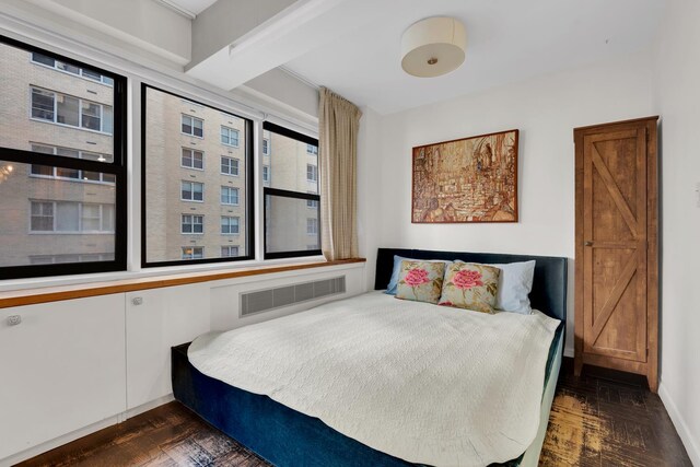 bedroom featuring dark wood-type flooring