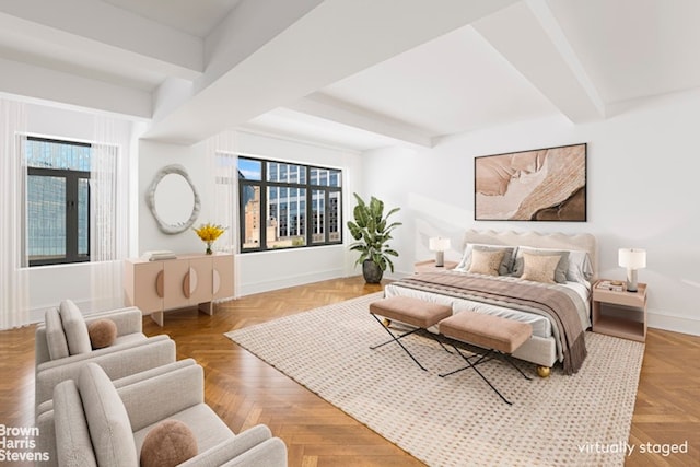 bedroom with beamed ceiling and baseboards