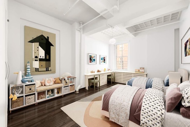 bedroom with hardwood / wood-style flooring and beamed ceiling