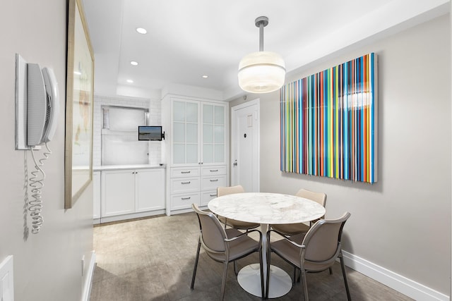 dining area with recessed lighting and baseboards