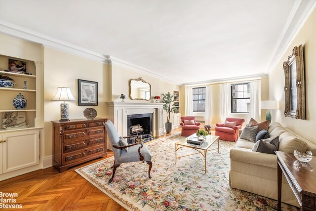 living room featuring crown molding, built in features, and light parquet floors