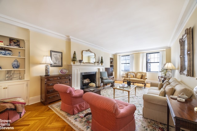 living area with built in features, baseboards, ornamental molding, and a fireplace