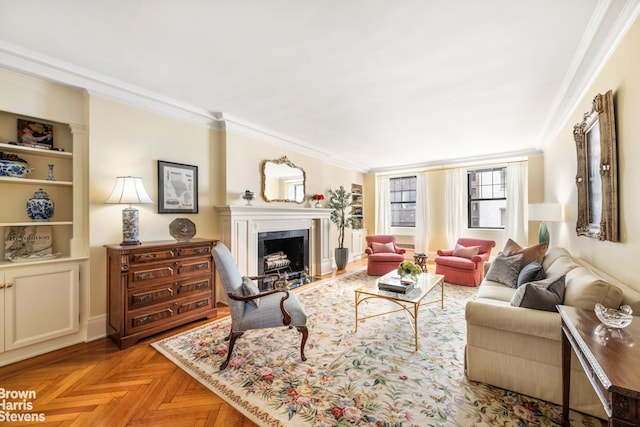 living area featuring a fireplace and crown molding