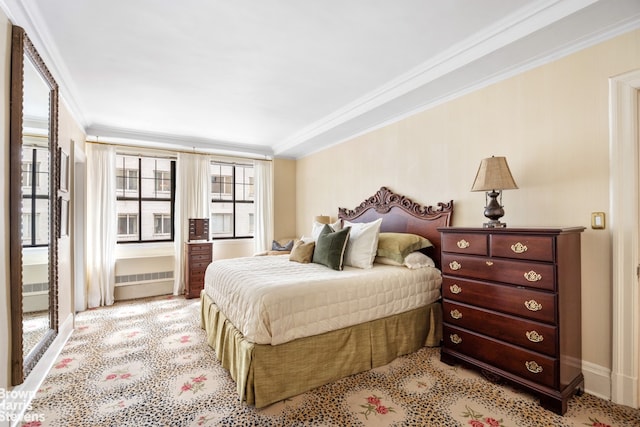 bedroom featuring baseboards and crown molding