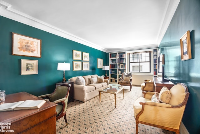 carpeted living area with baseboards and crown molding