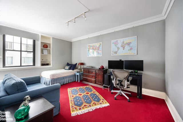 carpeted bedroom featuring rail lighting, baseboards, and ornamental molding