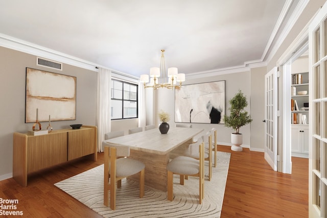 485 Park Ave Unit 4B, New York City, NY 10022 - dining area featuring a chandelier, ornamental molding, wood finished floors, and baseboards