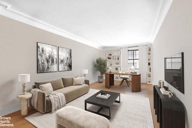 485 Park Ave Unit 4B, New York City, NY 10022 - living area with a desk, ornamental molding, light wood-style flooring, and baseboards