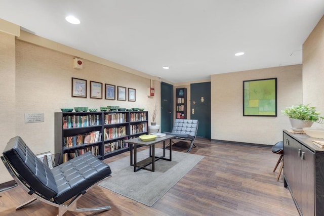 sitting room with hardwood / wood-style flooring