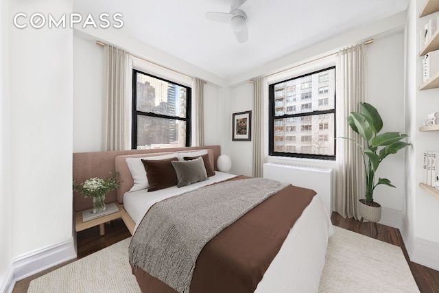 bedroom featuring hardwood / wood-style flooring and ceiling fan