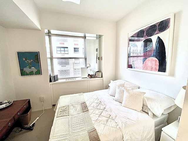 bedroom featuring carpet flooring and baseboards