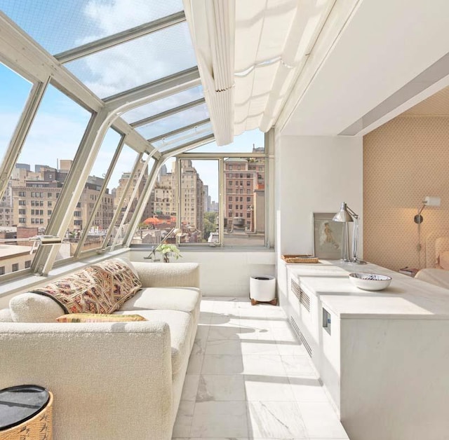 sunroom / solarium featuring a wealth of natural light, a view of city, and lofted ceiling