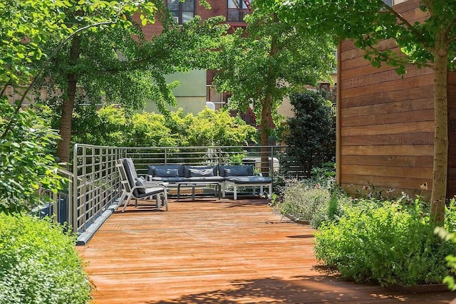 wooden deck featuring outdoor lounge area