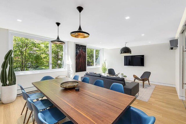 dining space with light wood-type flooring