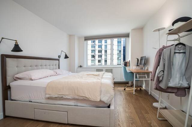 bedroom with wood-type flooring