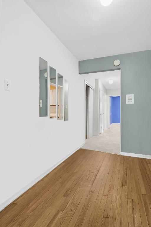 unfurnished room featuring wood-type flooring